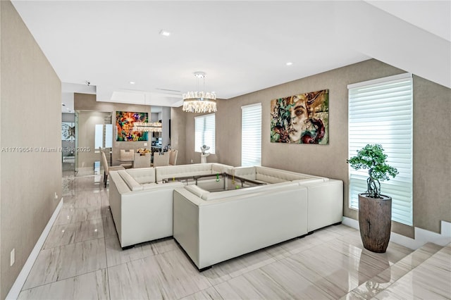 living room with an inviting chandelier