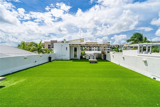 back of property featuring a lawn