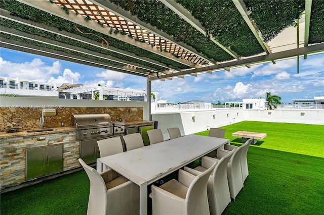 view of patio / terrace with sink, grilling area, and exterior kitchen