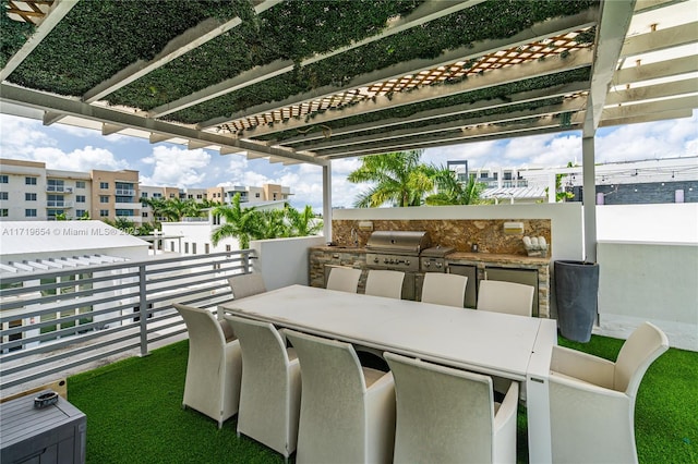 view of patio / terrace featuring a pergola, a grill, and exterior kitchen