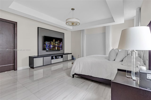 bedroom featuring a tray ceiling