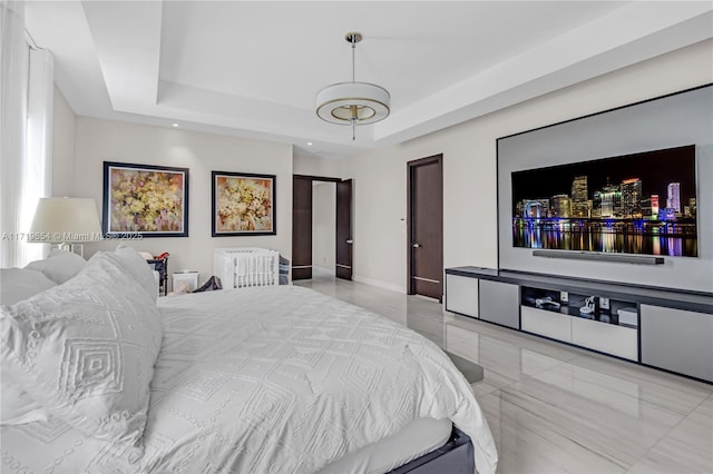 bedroom with a raised ceiling