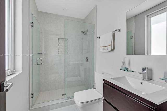 bathroom featuring tile patterned floors, vanity, an enclosed shower, and toilet