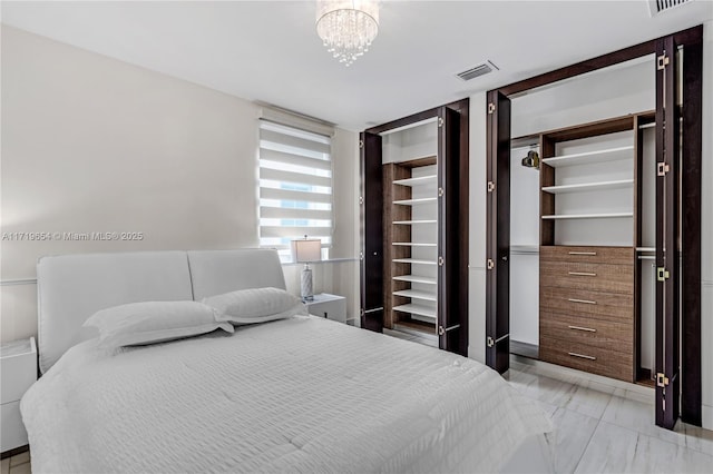 bedroom with an inviting chandelier