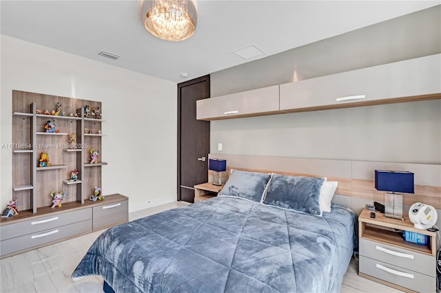 bedroom with an inviting chandelier