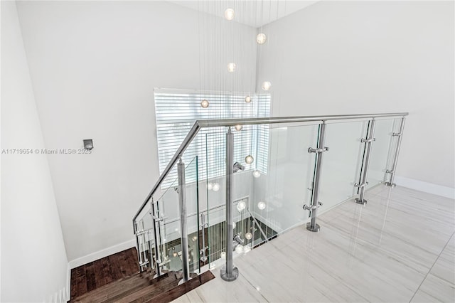 stairs featuring hardwood / wood-style floors