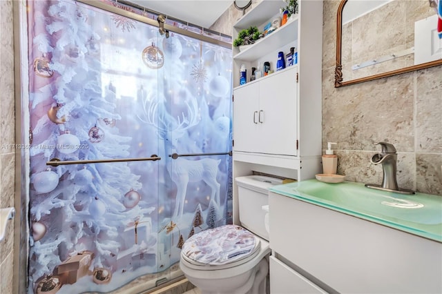 bathroom featuring walk in shower, vanity, and toilet