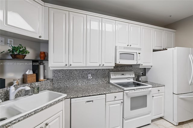 kitchen featuring white cabinets, decorative backsplash, white appliances, and sink