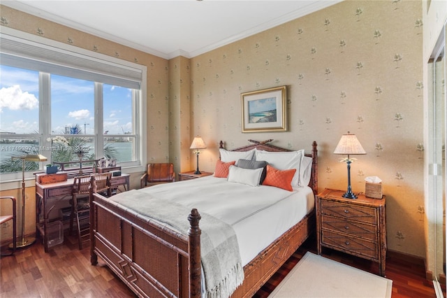 bedroom featuring dark hardwood / wood-style flooring and crown molding