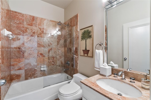 full bathroom with vanity, bath / shower combo with glass door, and toilet