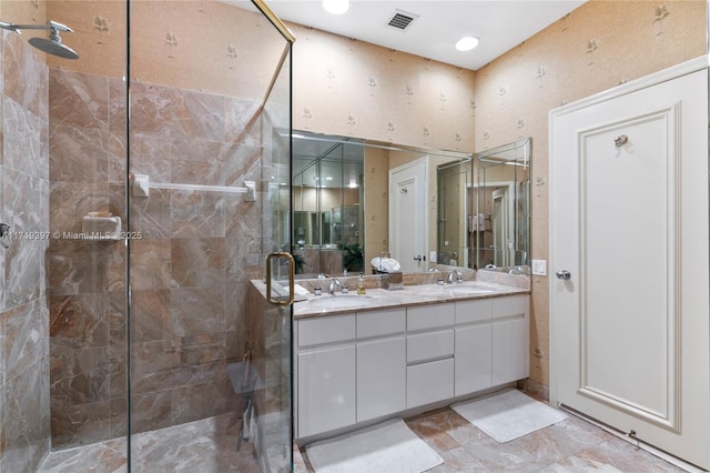 bathroom with vanity and an enclosed shower