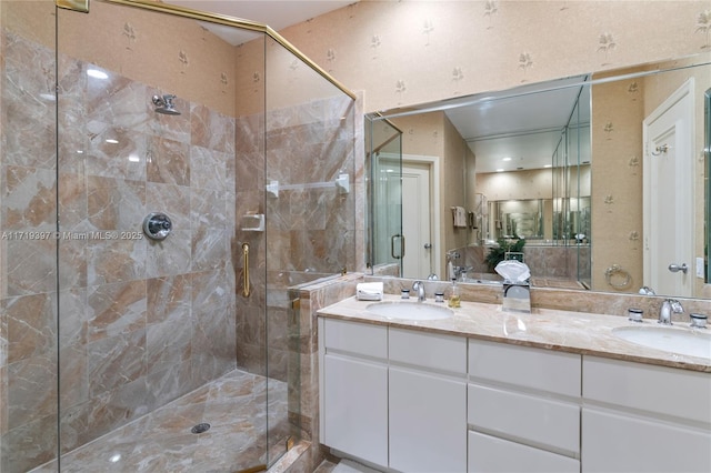 bathroom with vanity and a shower with shower door