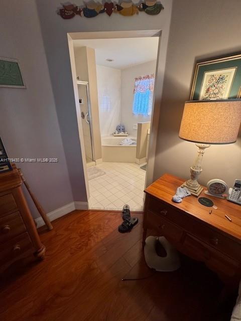 hallway featuring hardwood / wood-style flooring