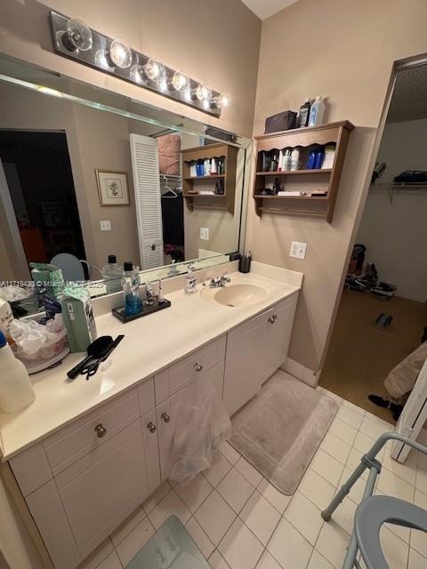 bathroom featuring tile patterned floors and vanity