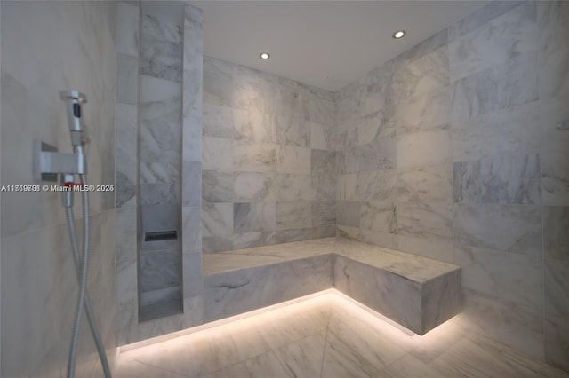 bathroom featuring a tile shower