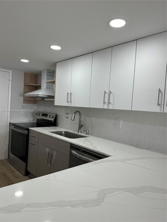 kitchen featuring electric stove, dishwashing machine, wall chimney exhaust hood, open shelves, and a sink