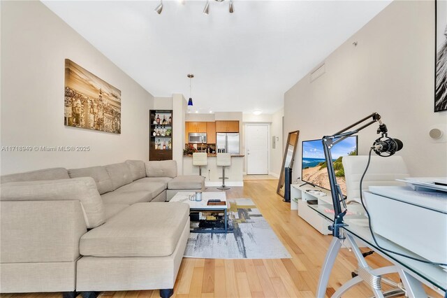 living room with light hardwood / wood-style floors