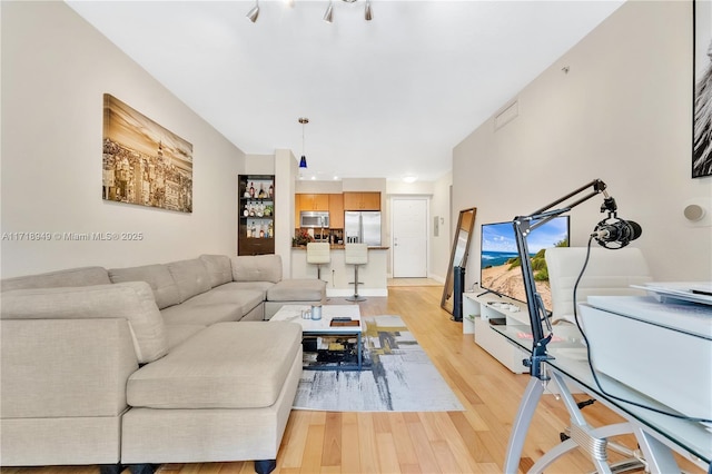 living room featuring light wood-style flooring