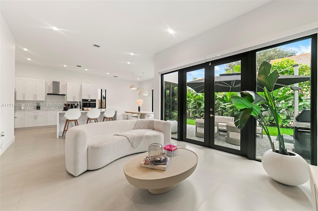 living room with plenty of natural light and french doors