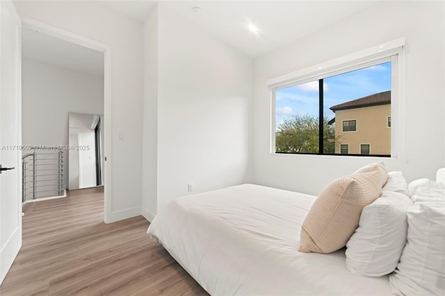 bedroom with light hardwood / wood-style floors