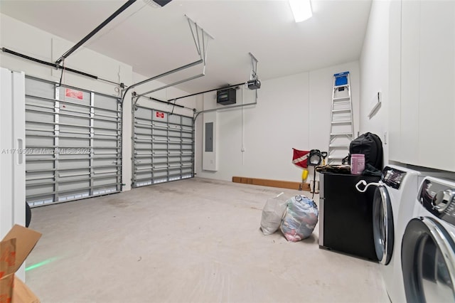 garage with a garage door opener, separate washer and dryer, and electric panel