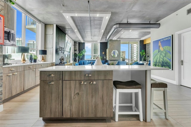 kitchen featuring a breakfast bar and a kitchen island