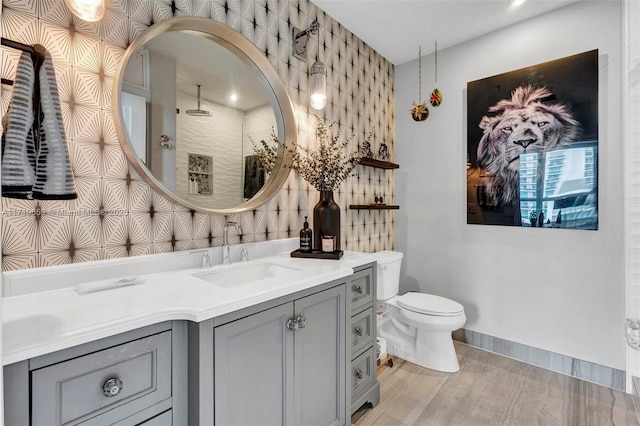 bathroom with toilet, a shower, vanity, and backsplash