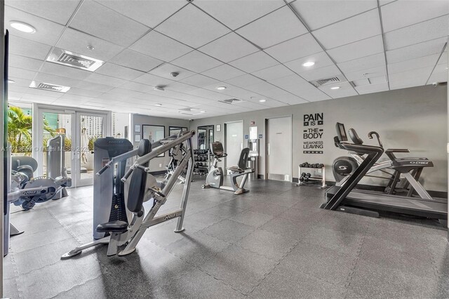 exercise room featuring a paneled ceiling