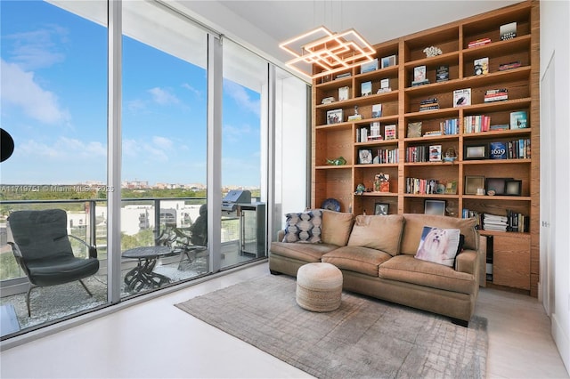 sitting room featuring floor to ceiling windows