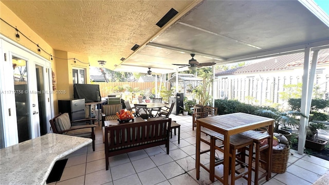 view of patio / terrace featuring ceiling fan, outdoor lounge area, and french doors