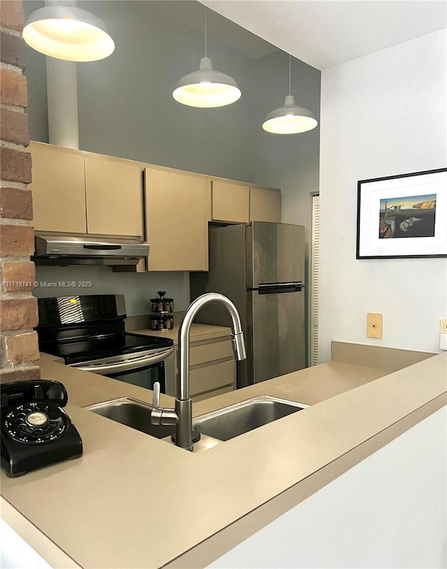 kitchen featuring pendant lighting, black electric range oven, ventilation hood, sink, and stainless steel fridge