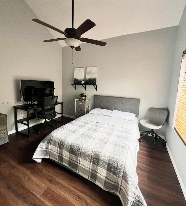 bedroom featuring ceiling fan, dark hardwood / wood-style floors, and vaulted ceiling