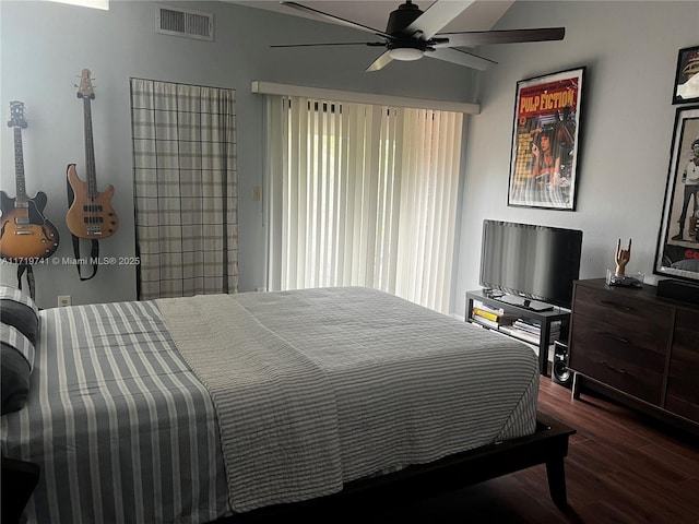 bedroom featuring ceiling fan and dark hardwood / wood-style flooring