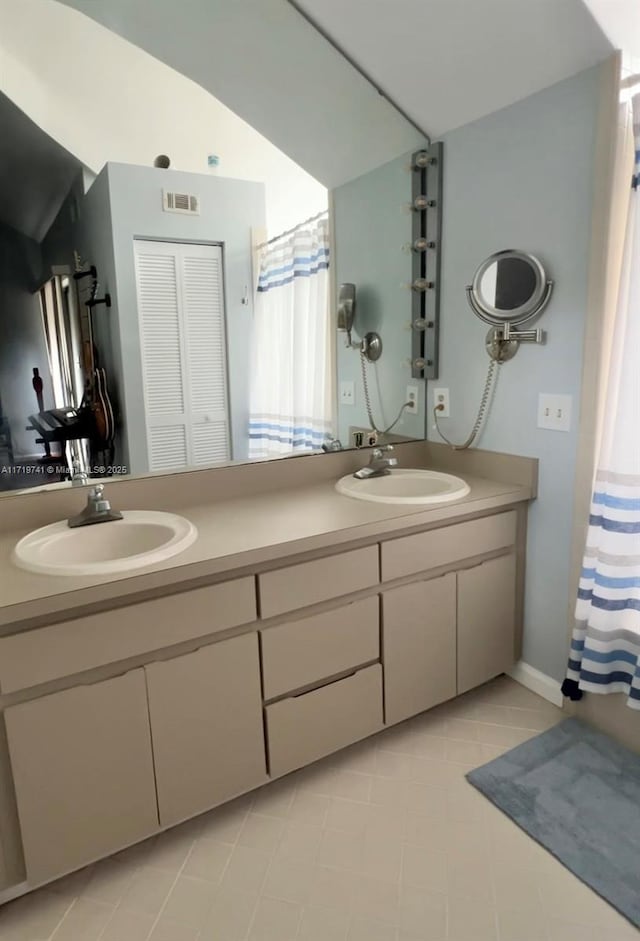 bathroom featuring vanity and tile patterned floors