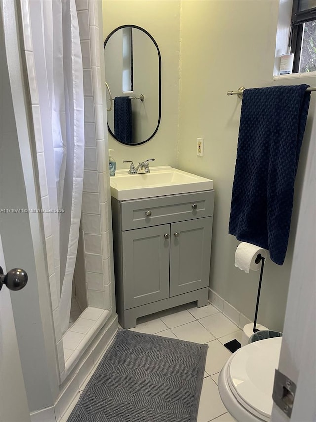 bathroom with tile patterned flooring, vanity, a shower with shower curtain, and toilet