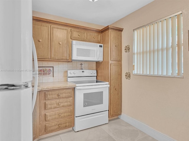 kitchen featuring white appliances, light tile patterned flooring, and tasteful backsplash