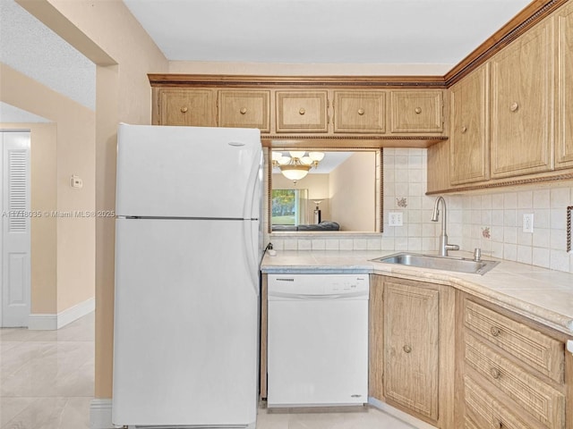 kitchen featuring sink, white appliances, decorative backsplash, and light tile patterned floors