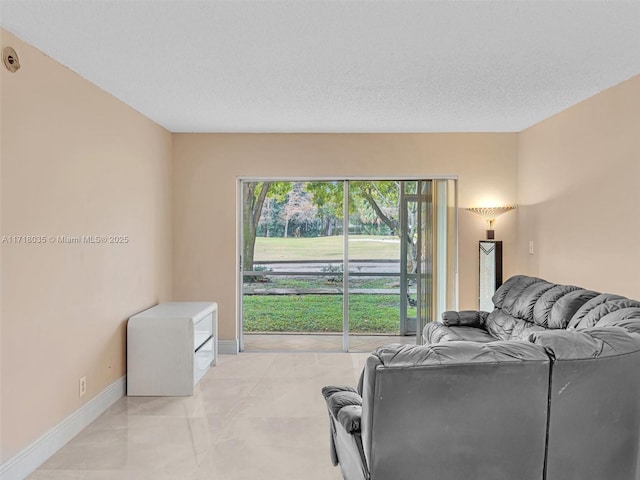 living room with a textured ceiling