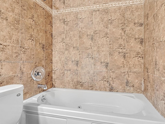 bathroom featuring a bathtub and toilet