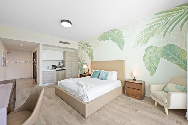 bedroom featuring access to exterior and wood-type flooring