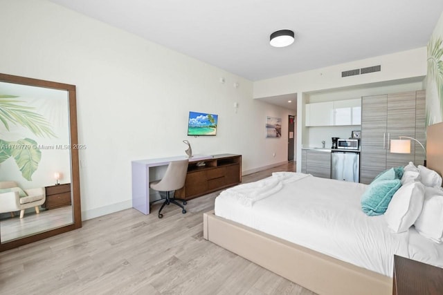 bedroom featuring light wood-type flooring