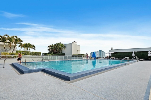 view of swimming pool with a patio area