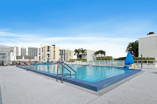 view of pool featuring a patio area