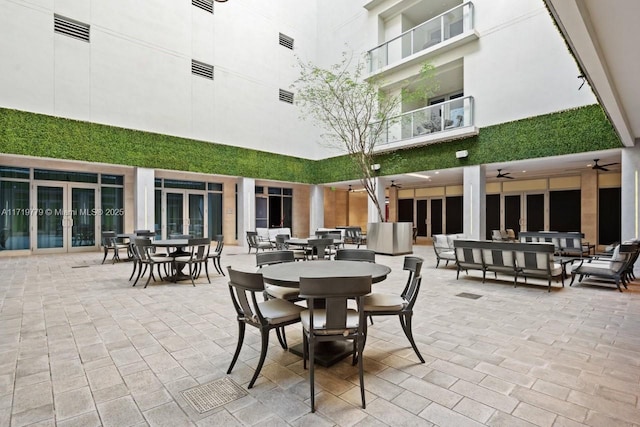 view of patio featuring ceiling fan, french doors, and outdoor lounge area