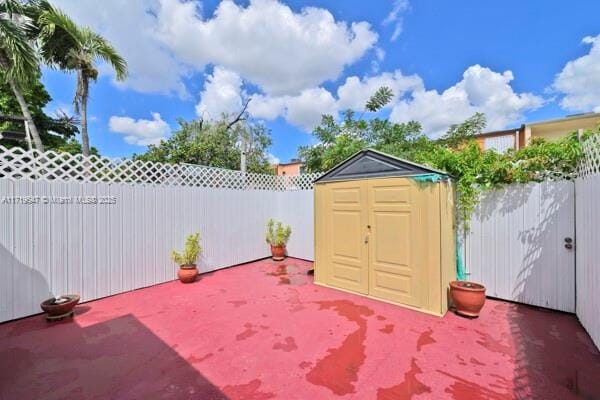 view of patio / terrace with a storage shed