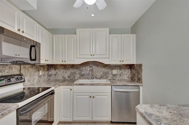 kitchen with tasteful backsplash, sink, white cabinets, ceiling fan, and black appliances