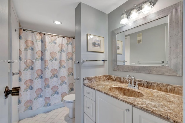 bathroom featuring vanity, tile patterned flooring, and toilet