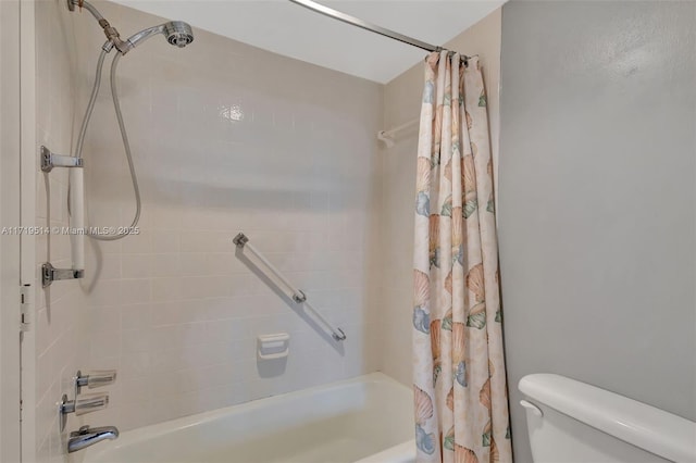 bathroom with toilet and shower / bath combo with shower curtain