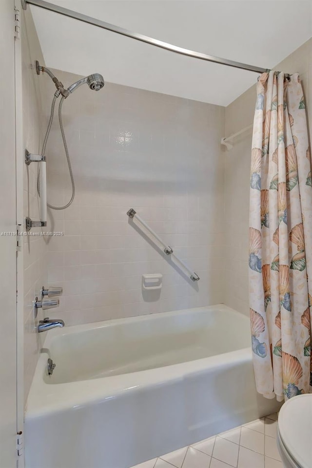 bathroom with shower / bathtub combination with curtain, tile patterned floors, and toilet