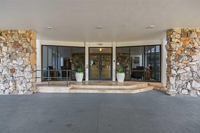 property entrance featuring french doors